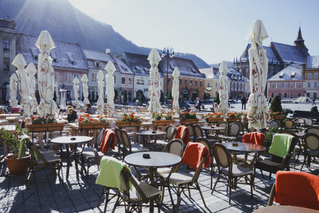 BRASOV, ROMANIA NOVEMBER 1, 2017: view of the street cafe on the main square in the historic city center Brasov. BRASOV, ROMANIA, November 1, 2017のeditorial素材