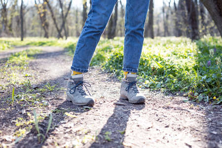 hiking boots close-up on the background of the forestの写真素材