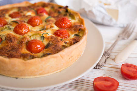 pie with  cheese brie and cherry tomatoes - french cuisineの写真素材