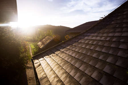 atmospheric morning on a farm in the village  in the mountain. small street, roof and dawn rays. 
の写真素材