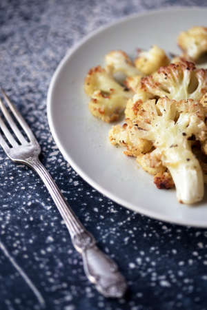 baked cauliflower in  at the wooden table. french cuisineの写真素材
