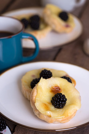 Pastel de nata famous portuguese cake with blackberries