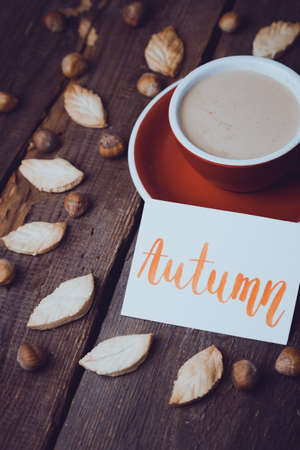 red cup of coffee and leaf shape cookiesの写真素材