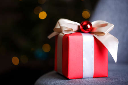 preparation for the holiday - a  gift on a red background. Birthdayの写真素材
