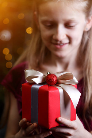 girl holding christmas presents in hands -  happy New Year