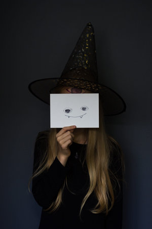 Halloween girl with a pattern on her face