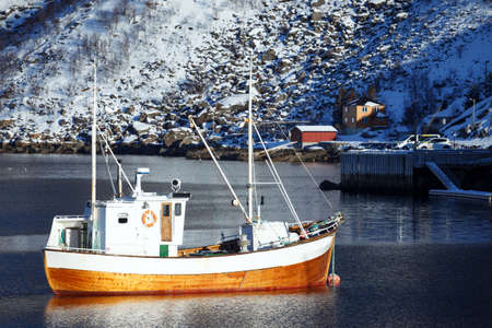 Little bay in winter on Lofoten islands. ships and rorbu. Norwayの写真素材