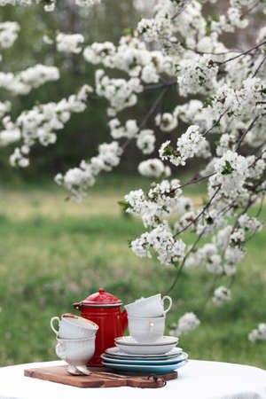 steel life - breakfast in the spring garden. table with white tablecloth served for tea drinkingの写真素材