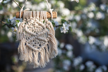 creation of panels from macrame  in the spring garden. creativity and recreation