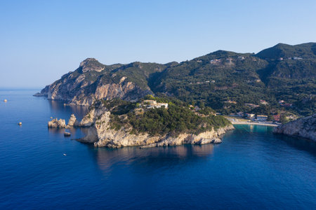 Aerial view of Paleokastritsa coast with Paleokastritsa monastery on top of rocky cliff. Corfu island, Greeceの写真素材