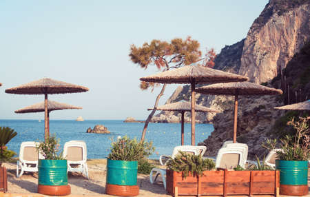 beautiful beach. umbrellas and sun loungers on the beachの写真素材