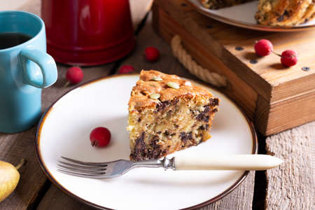 pear pie with chocolate and a cup of tea. bright breakfastの写真素材