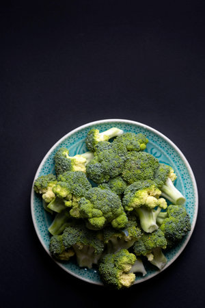 broccoli on a black background. summer harvest