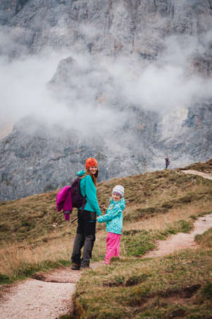 family - mother and daughter hikers at the mountains Dolomites, Italy. Tre Cime di Lavaredoの写真素材