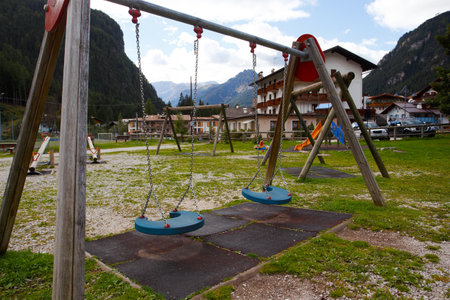 empty playground in a small alpine townの写真素材