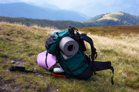 tourist backpack on the background of a mountain landscape