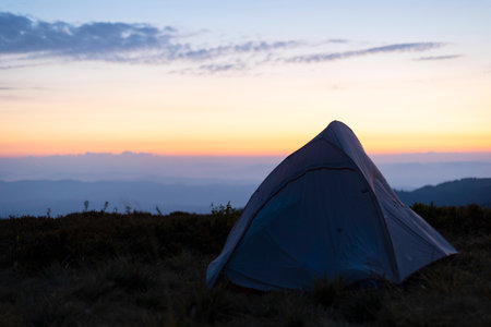 tourist tents on the background of a mountain landscapeの写真素材