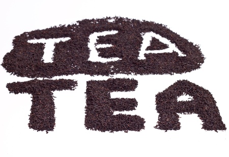 a scattering of black tea on a white backgroundの写真素材