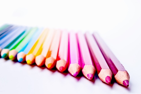 a bunch of colored pencils on a light backgroundの写真素材