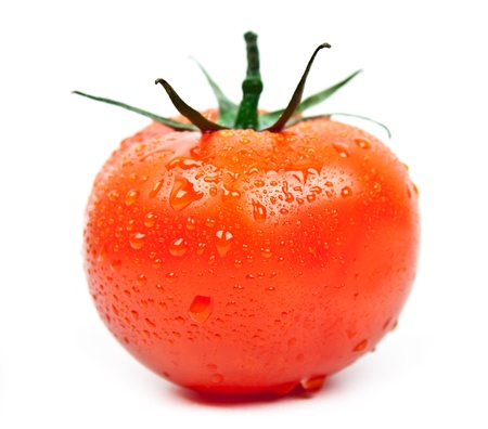 fresh tomato with drops of water on a white backgroundの写真素材
