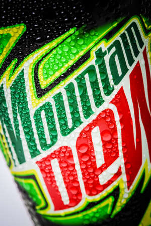SABAH, MALAYSIA - january 13, 2015: Bottle of Mountain Dew drink on ice isolated on white. Mountain Dew citrus-flavored soft drink produced by PepsiCo. Mountain Dew was introduced in 1940のeditorial素材