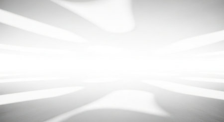 This image features a minimalist composition of light rays converging towards a central point. The white background is illuminated by several beams of light that create a sense of depth and perspective. The play of light and shadow adds a dynamic quality to the image, evoking a sense of tranquility and focus.の素材