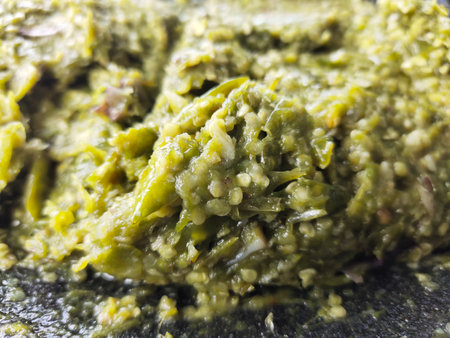 Close up of a plate of pesto sauce on a black backgroundの写真素材