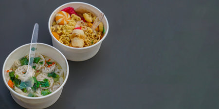 Two bowls of seblak on the table and there was space availableの写真素材