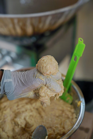 Form the fried meatball dough into balls before fryingの写真素材