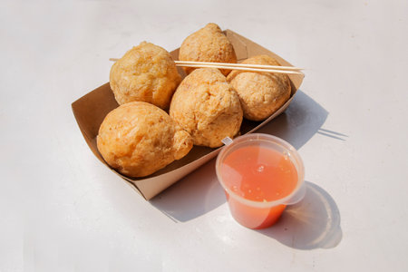 Fried Meatball dish and sauce on white backgroundの写真素材