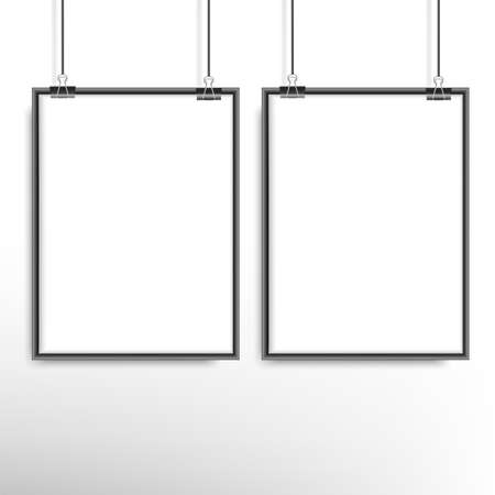 Two blank frames hang on clips near the wall. Vector.のイラスト素材