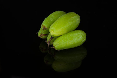 Bilimbi fruits (averhoa belimbi) isolated on black background with small reflection