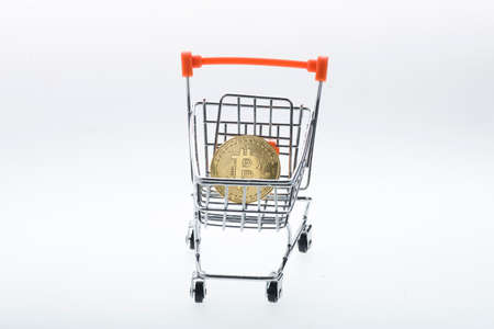 Bitcoin & cryptocurrency in shopping cart isolated on white backgroundの写真素材