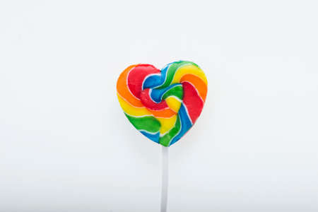 Colorful love lollipop isolated on white backgroundの写真素材