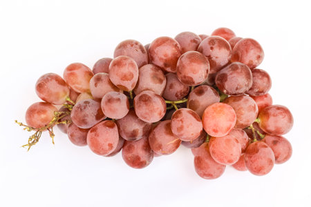 Close up of a bunch of fresh grapes isolated on a white background.の写真素材