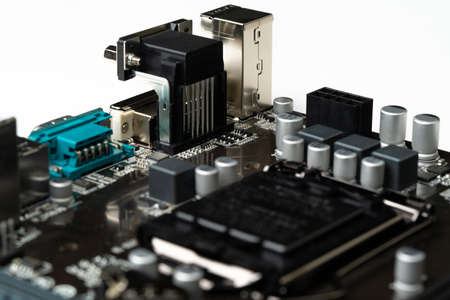 Computer motherboard hardware with capacitors, transistors and connectorsの写真素材