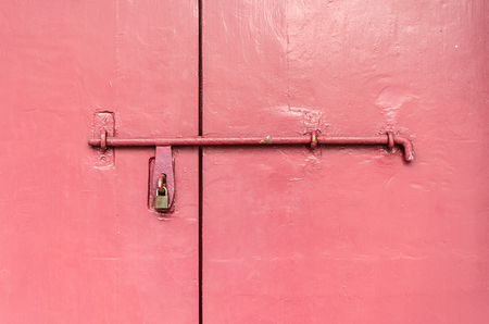 Bolts attached to the old wooden door.の写真素材