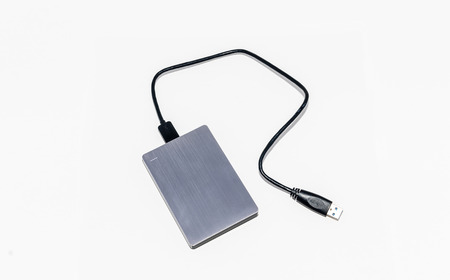 External harddisk gray on a white background.の写真素材
