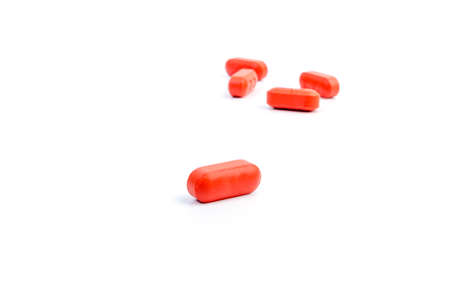 vitamin orange pills on a white backgroundの写真素材
