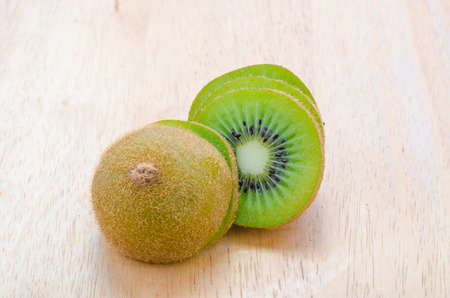 Kiwi fruit on wooden backgroundの写真素材