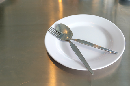 Empty plate on the tableの写真素材
