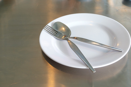 Empty plate on the tableの写真素材