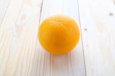 fresh oranges on wood backgroundの写真素材
