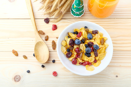 Corn flakes and Berries on wooden backgroundの写真素材