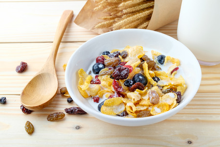 Corn flakes and Berries on wooden backgroundの写真素材