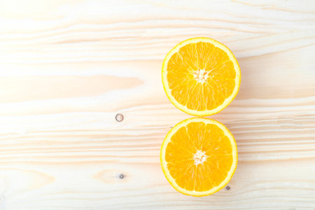 Fresh oranges on a wooden table