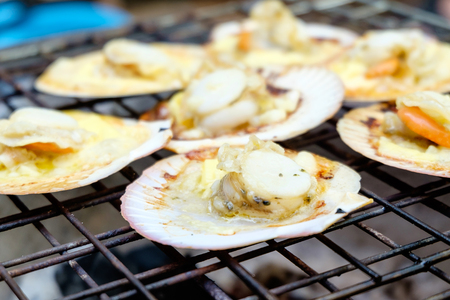Grilled scallops with charcoal stoveの写真素材
