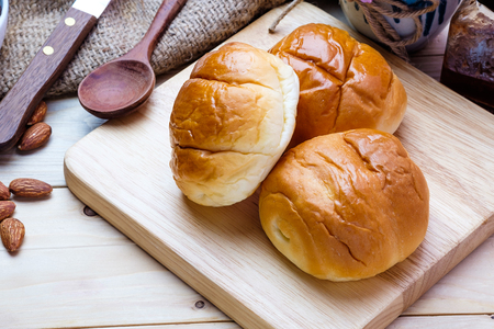 Butter roll on wooden backgroundの写真素材