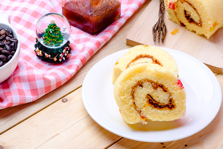Sliced Cake Roll on wooden backgroundの写真素材