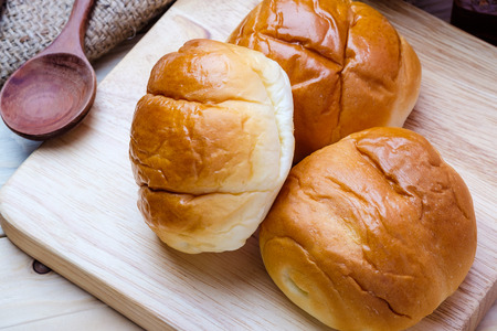 Butter roll on wooden backgroundの写真素材